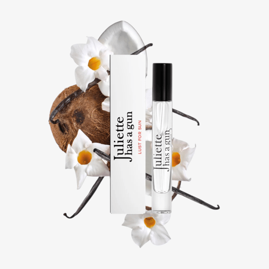 Close-up of juliette has a gun lust for sun edp miniature 7.5 ml bottle
