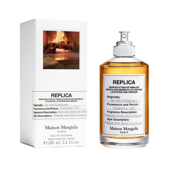 Elegant bottle of maison margiela replica by the fireplace
