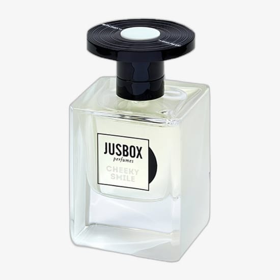 Close-up of jusbox perfumes cheeky smile edp miniature Jusbox perfumes cheeky smile edp miniature 7.8ml bottle