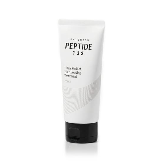 Close-up of COSRX Peptide 132 Hair Bonding Treatment bottle, COSRX Peptide 132 Hair Bonding Treatment texture detail