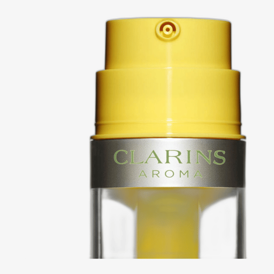 Clarins Aroma Plant Gold Nutri-Revitalizing Oil-Emulsion bottle close-up showing the elegant, dual-chamber design