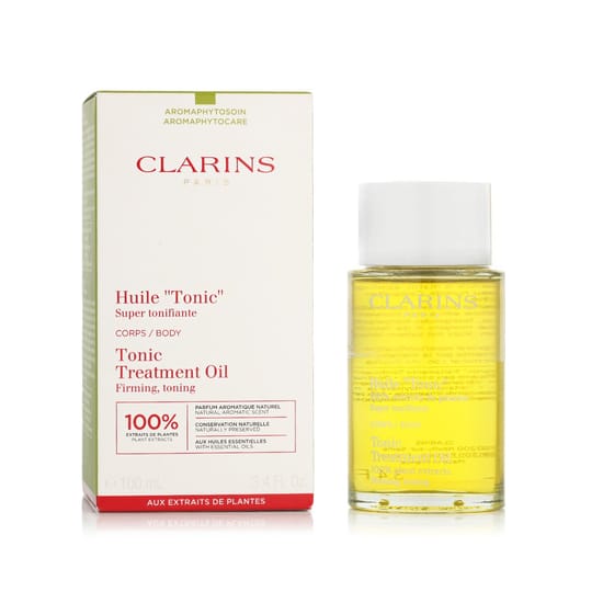 Bottle of clarins tonic treatment oil on a wooden surface