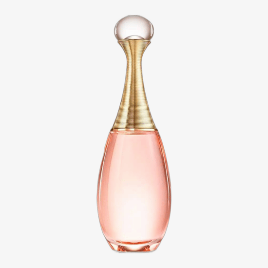 Флакон Dior J'adore Eau de Toilette EDT крупным планом, элегантная композиция на фоне нейтральных оттенков