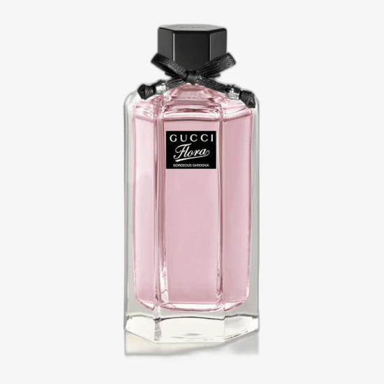 Elegant presentation of Gucci Flora Gorgeous Gardenia EDP set with perfume, mini bottle, and body lotion