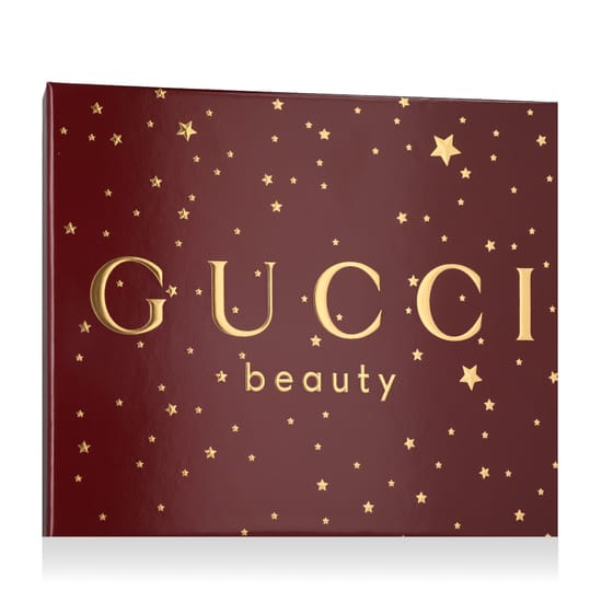 Elegant presentation of Gucci Flora Gorgeous Gardenia EDP set with perfume, mini bottle, and body lotion