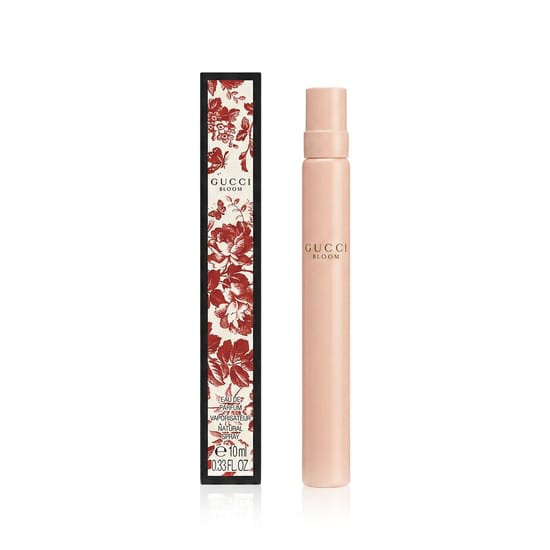 Close-up of Gucci Bloom EDP Miniature bottle, elegant and minimalist floral design
