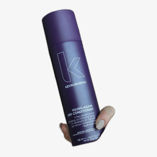Bottle of Kevin Murphy Young.Again Dry Conditioner on a white background