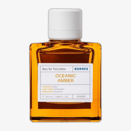 Elegant bottle of Korres Oceanic Amber EDT reflecting aquatic and amber tones