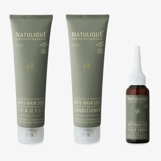 Bottle of Natulique anti-hair loss shampoo