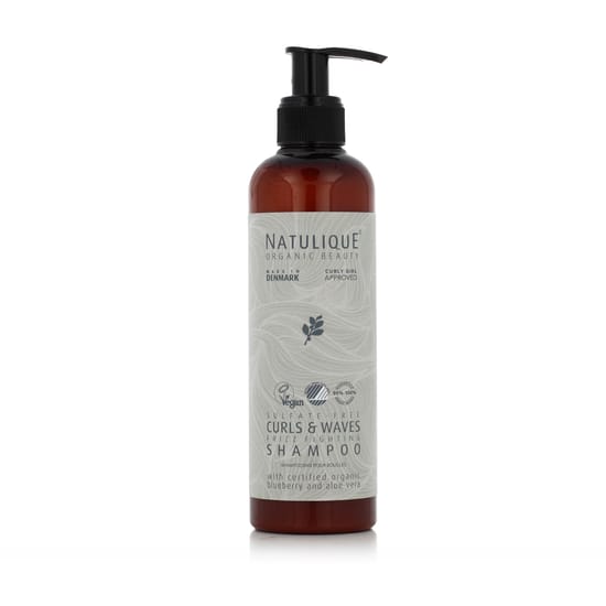 Bottle of Natulique Curls and Waves Shampoo for curly hair care