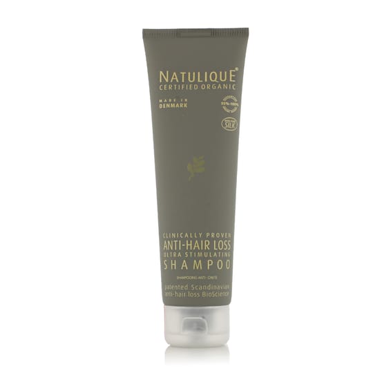 Bottle of Natulique anti-hair loss shampoo