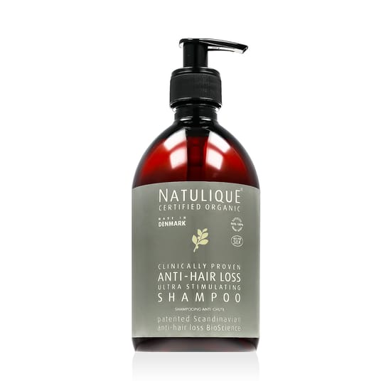 Bottle of Natulique anti-hair loss shampoo
