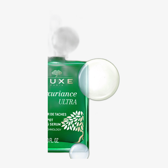 Detailed view of Nuxe Nuxuriance Ultra Dark Spot Correcting Serum bottle with elegant design