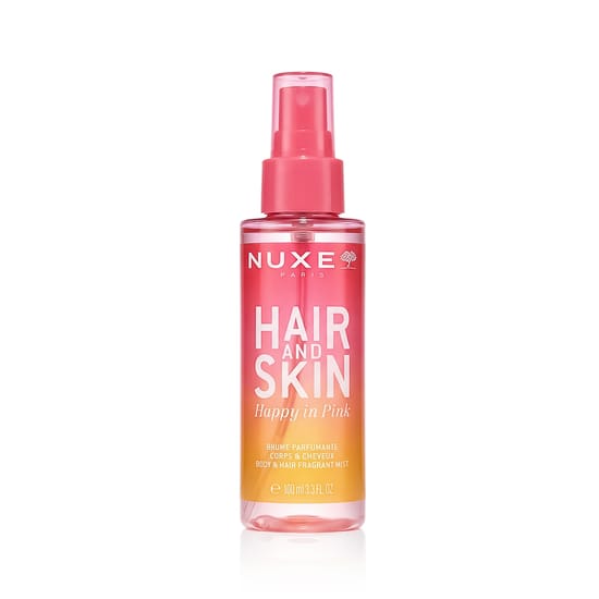 Close-up of Nuxe Happy In Pink Hair & Body Mist bottle