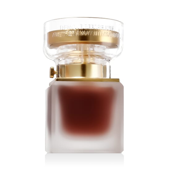 Elegant bottle of Oscar De La Renta Alibi Eau Sensuelle EDP