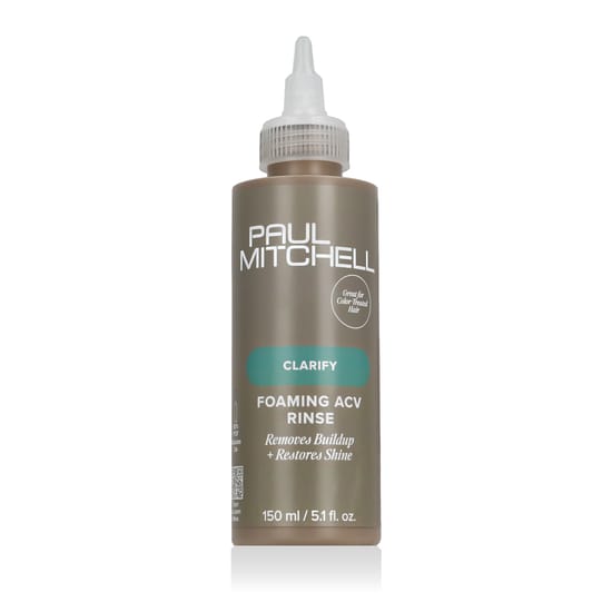 Paul Mitchell Clarify Foaming ACV Rinse Packaging and Bottle Paul Mitchell Clarify Foaming ACV Rinse bottle surrounded by vibrant, natural ingredients