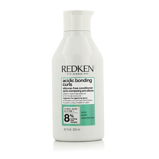 Close-up of Redken Acidic Bonding Curls Conditioner Bottle