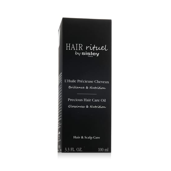 Original packaging of Sisley Hair Rituel Precious Hair Care Oil Close-up of Sisley Hair Rituel Precious Hair Care Oil bottle