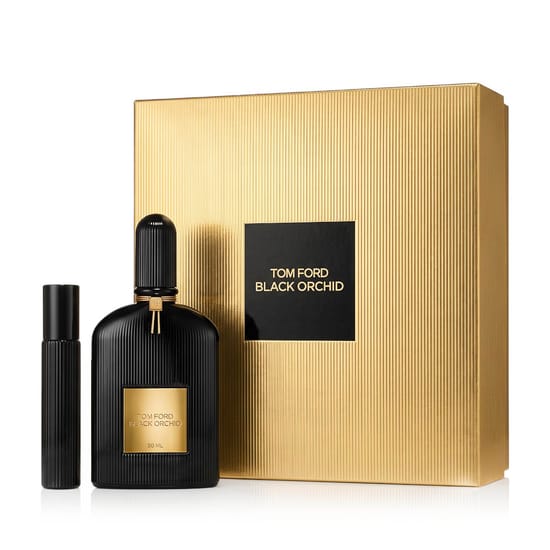 Sleek bottle of Tom Ford Black Orchid Eau de Parfum with mini travel companion