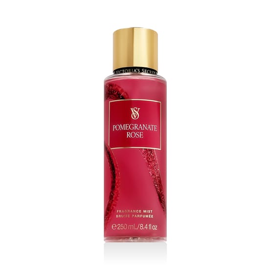 Bottle of Victoria's Secret Pomegranate Rose Bodyspray displayed with wheat flowers, evoking a sense of freshness