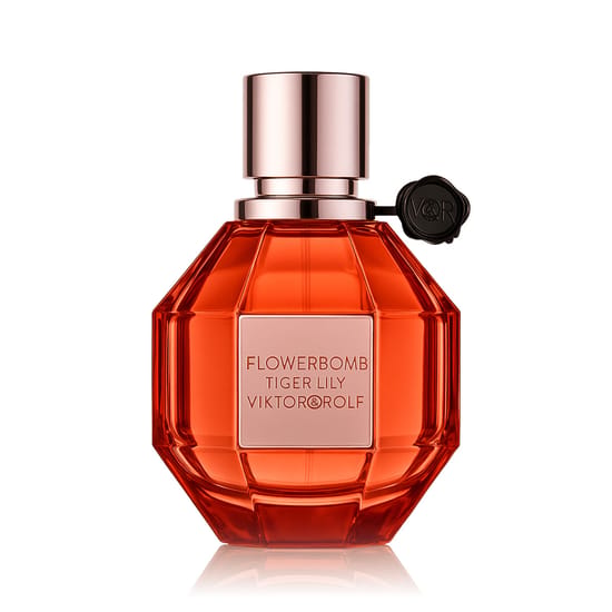 Sophisticated bottle of Flowerbomb Tiger Lily Eau De Parfum on a minimalist background