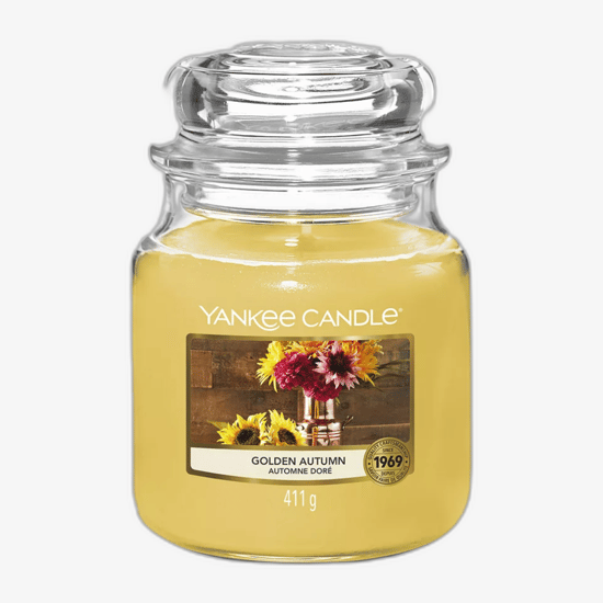 Средняя ароматическая свеча Yankee Candle Golden Autumn в банке