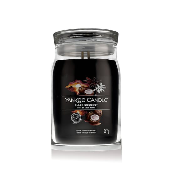 Close-up of yankee candle black coconut scented candle