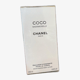 Õrnalt kumav Chanel Coco Mademoiselle kehakreemi pudel minimalistliku stiiliga