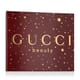 Elegant presentation of Gucci Flora Gorgeous Gardenia EDP set with perfume, mini bottle, and body lotion