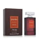 Close-up of Jenny Glow Dark Amber EDP bottle