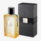 Elegant bottle of Lalique Les Compositions Parfumées Gold EDP
