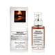 Elegant bottle of maison margiela replica by the fireplace