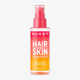 Close-up of Nuxe Happy In Pink Hair & Body Mist bottle