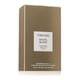 Elegant bottle of Tom Ford Soleil Blanc Shimmering Body Oil radiating a golden shimmer