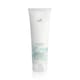 Флакон Wella Nutricurls Waves & Curls Cleansing Conditioner на фоне локонов